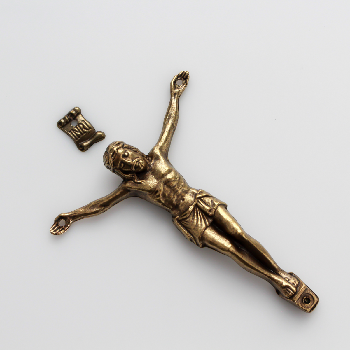 A beautifully detailed bronze corpus that comes with an INRI scroll sign