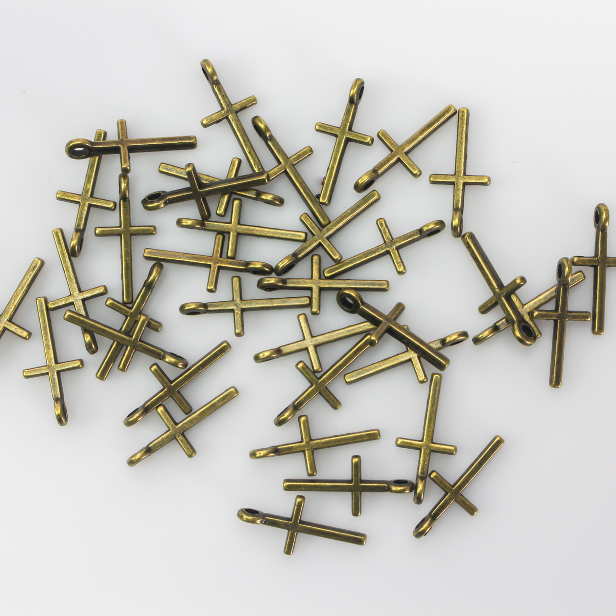 simple bronze cross charm 17mm long