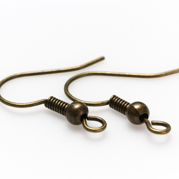 Brass earring hooks with a horizontal loop and an antiqued bronze finish. 23 gauge wire. Sold in packages of 30 hooks (15 pairs).