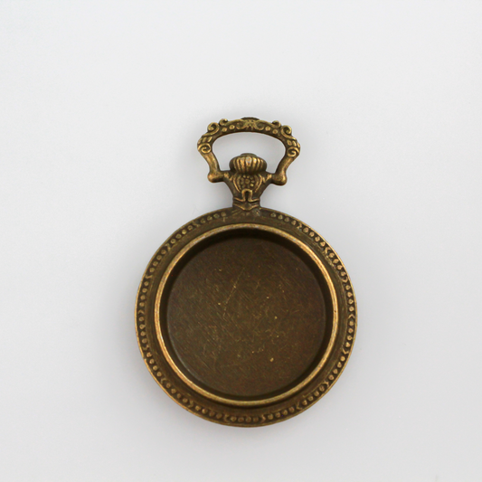 Large bronze cabochon setting shaped like an old ornate pocket watch with a 33mm tray.