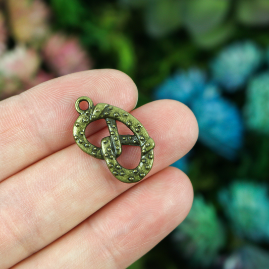 Small bronze pretzel charm 22mm long x 13mm wide