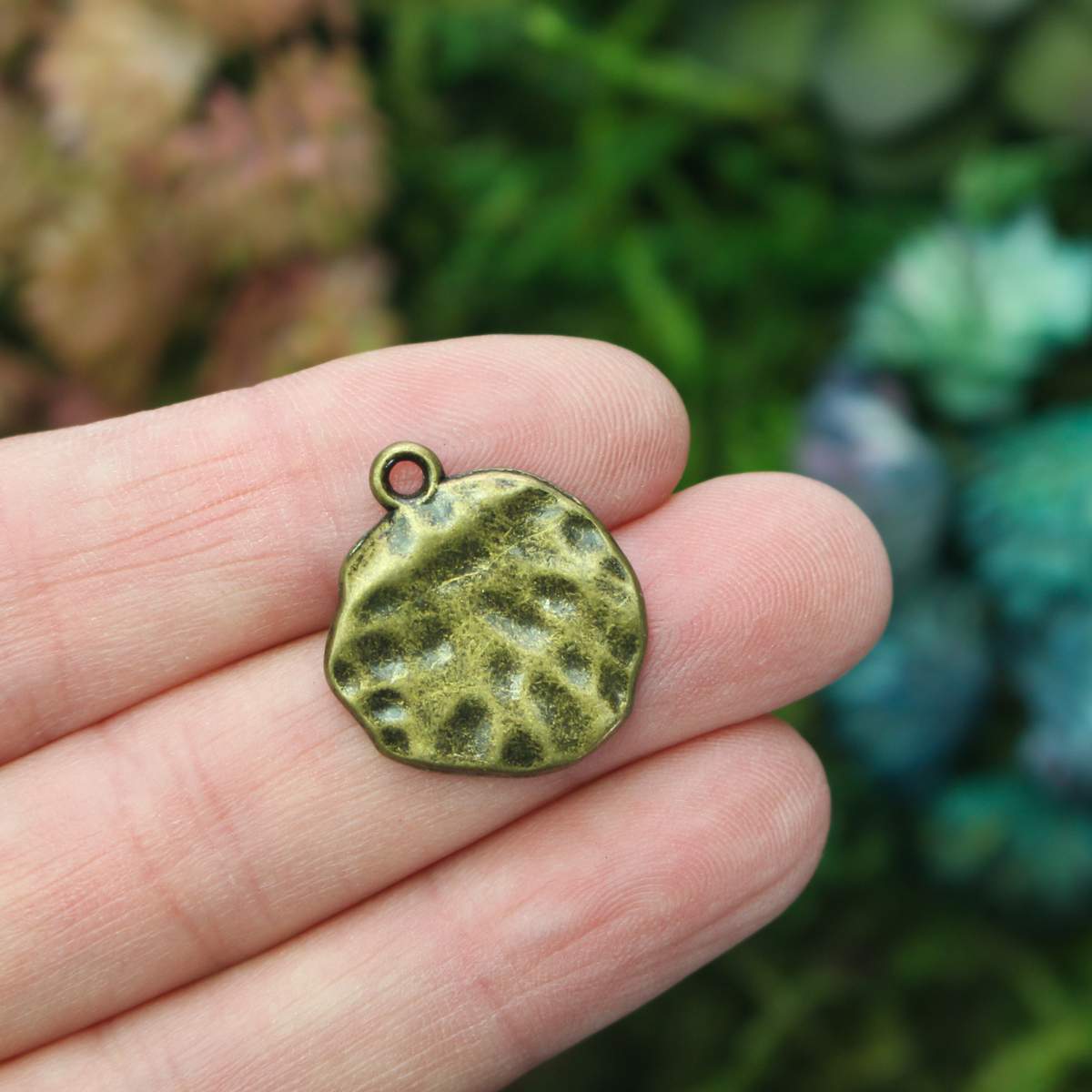 Rustic round cross charms in an antique bronze finish 22mm long