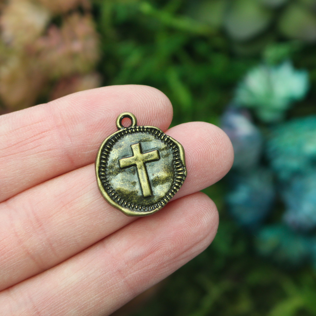 Rustic round cross charms in an antique bronze finish 22mm long