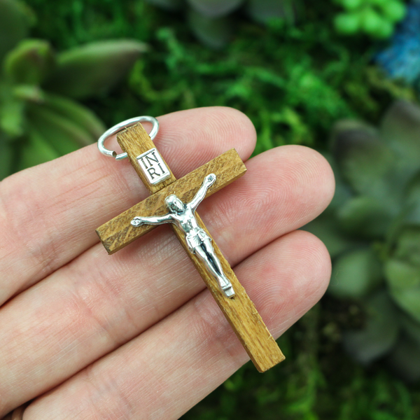 brown wooden crucifix pendant with a silver tone metal body of jesus christ 1-3/4" long
