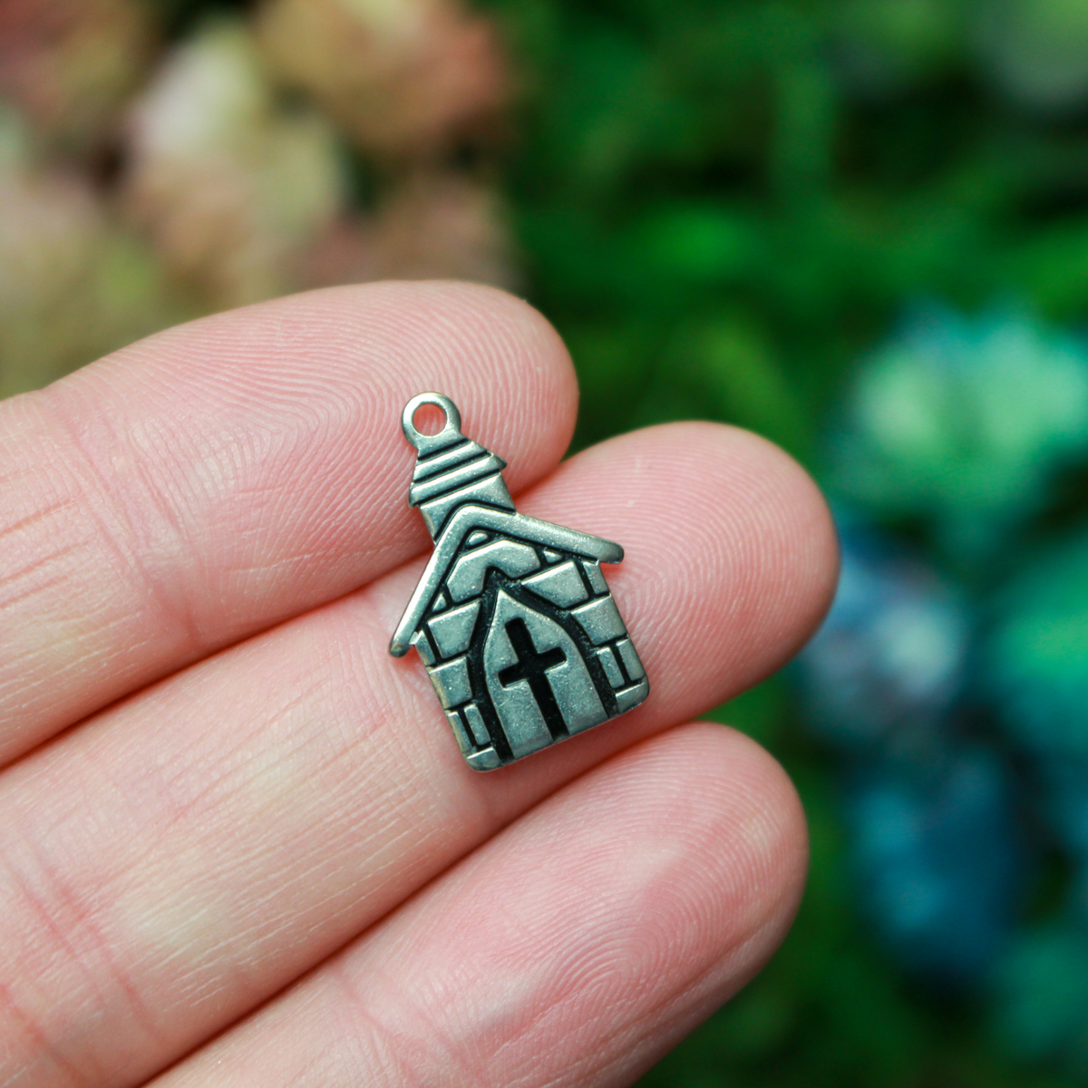 Small church charm. The charm is made of 304 stainless steel with black enamel details, 0.75" long