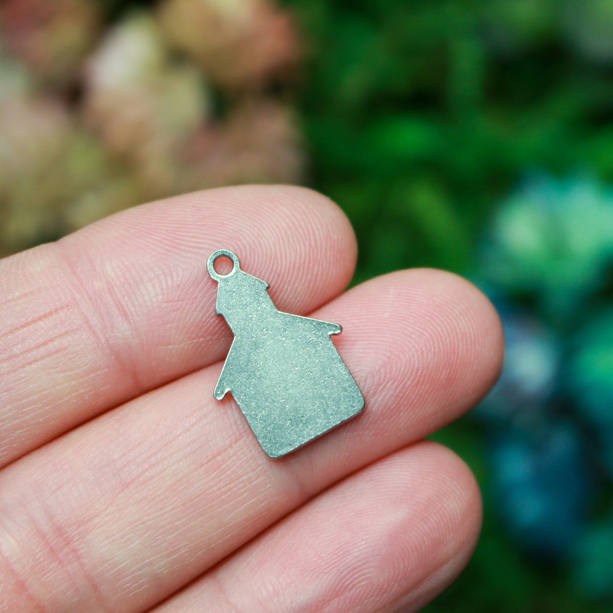 Small church charm. The charm is made of 304 stainless steel with black enamel details, 0.75" long