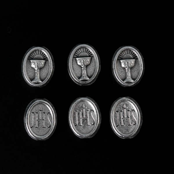 Holy Communion metal beads that depicts a chalice on the front and the Christogram "JHS" on the back
