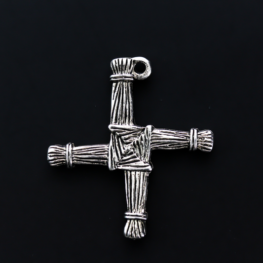 Brigid's cross charm 1-1/8" long The cross is an antiqued silver-tone color and looks the same on both sides. There is no jump ring attached to the bail