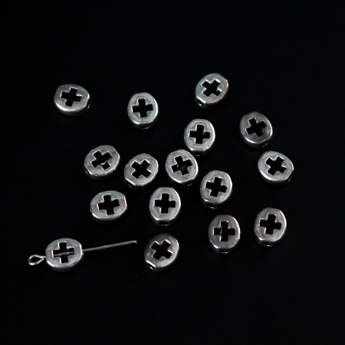 Silver metal spacer beads with a cross cutout design, 6.5mm x 5.5mm