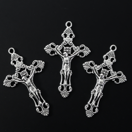 Three ornate fleur de lis crucifix cross in an antiqued silver-tone color and filigree cut out design
