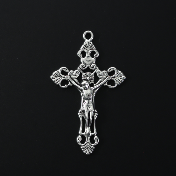 large ornate fleur de lis crucifix cross in an antiqued silver-tone color and filigree cut out design