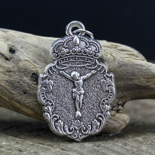 ornate jesus crucifixion medal