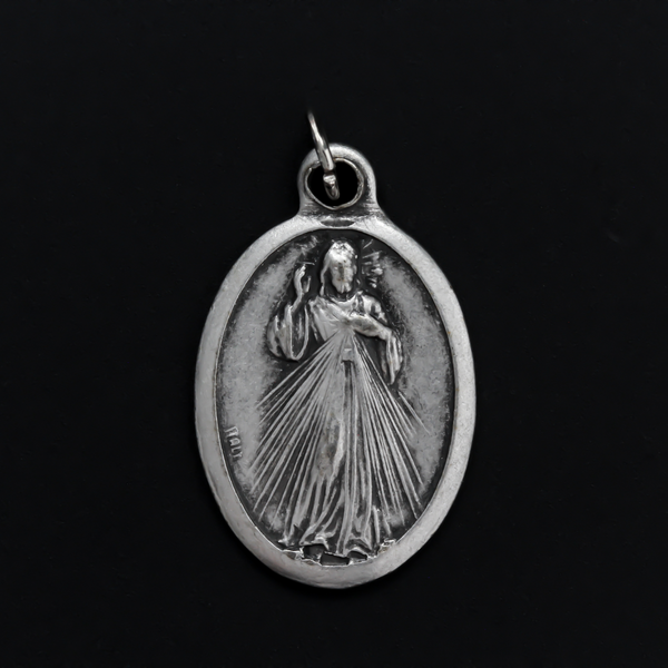 Divine Mercy medal with an image of Jesus on the front and the words "Jesus, I Trust in you!" on the back