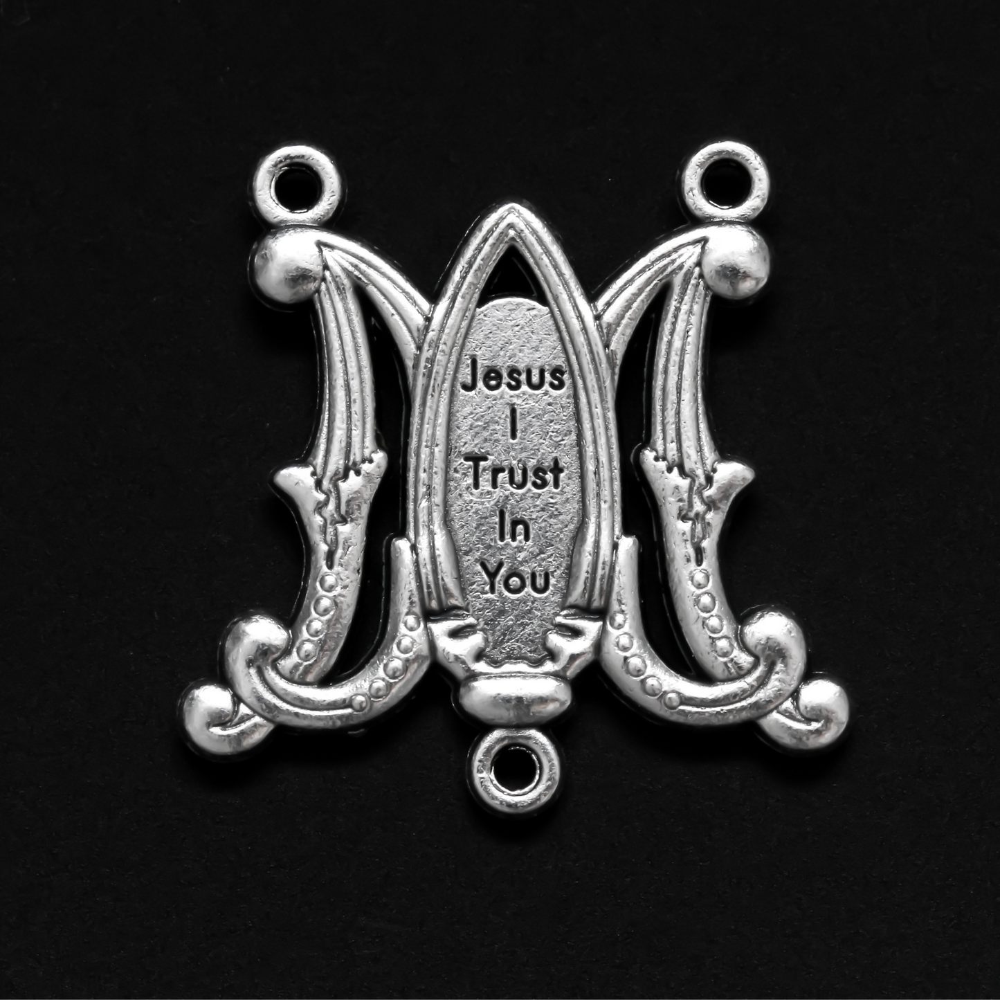 rosary centerpiece in the shape of an intertwined A and M for "Ave Maria" with the Divine Mercy of Jesus in the center