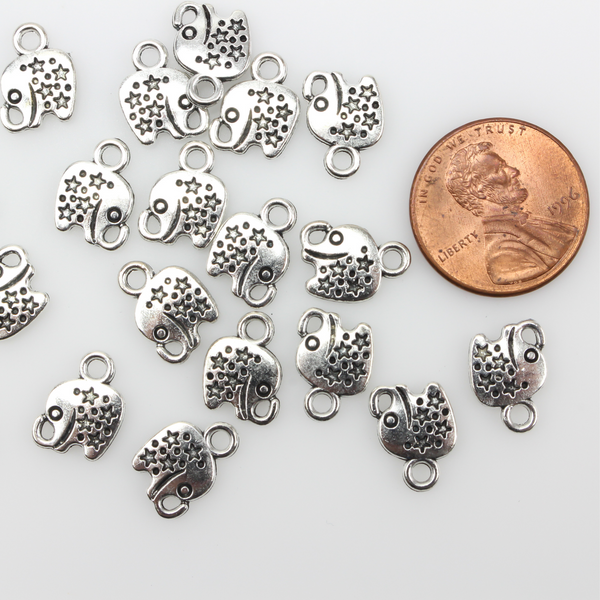 Tiny antiqued silver elephant charms with stars on the body