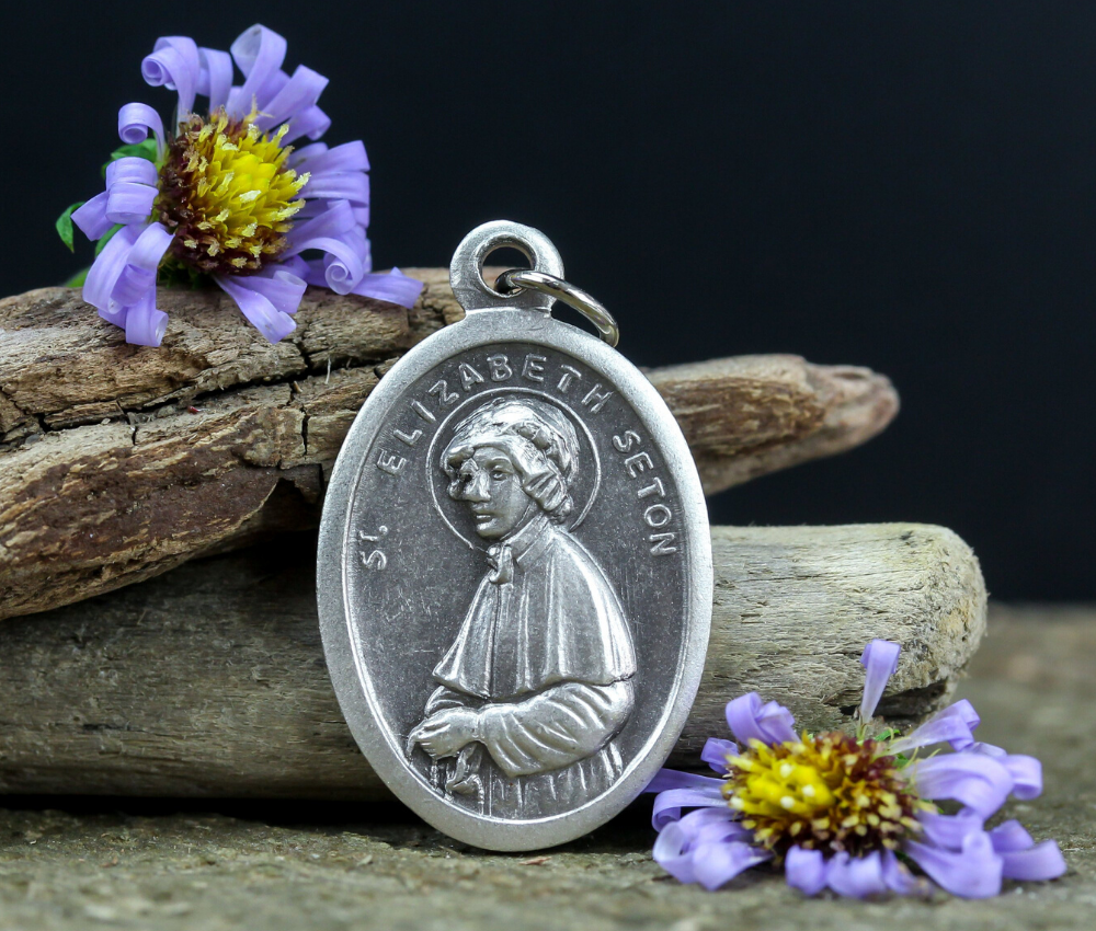 die cast silver medal depicting patron saint elizabeth ann seton