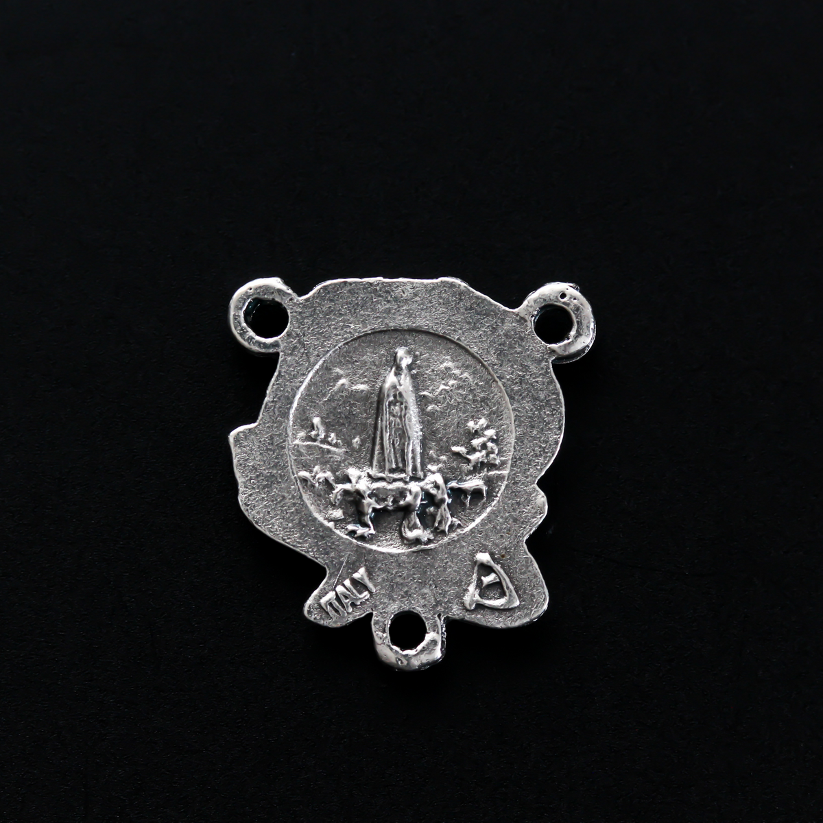 Beautiful rosary centerpiece that is shaped like a rose with Our Lady of Fatima on the back.