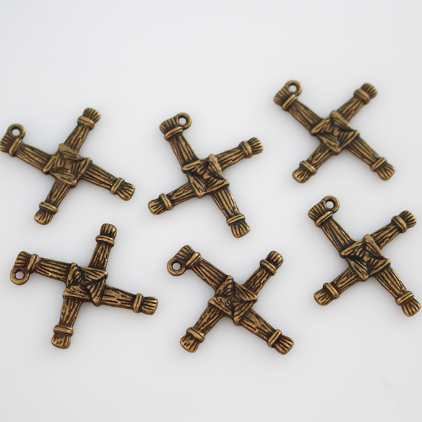 St. Brigid's cross pendant. The cross is an antiqued bronze color and looks the same on both sides. There is no jump ring attached to the bail.