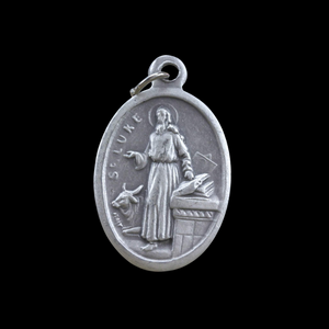 saint luke die cast one inch oval medal