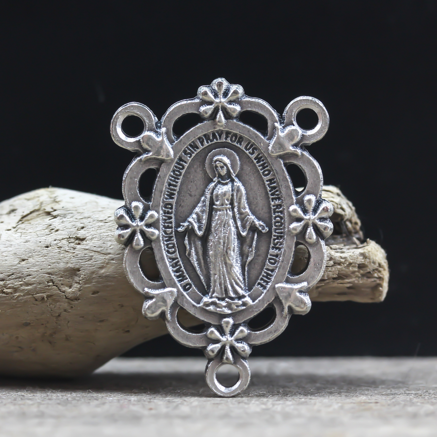 miraculous medal rosary centerpiece with ornate floral border