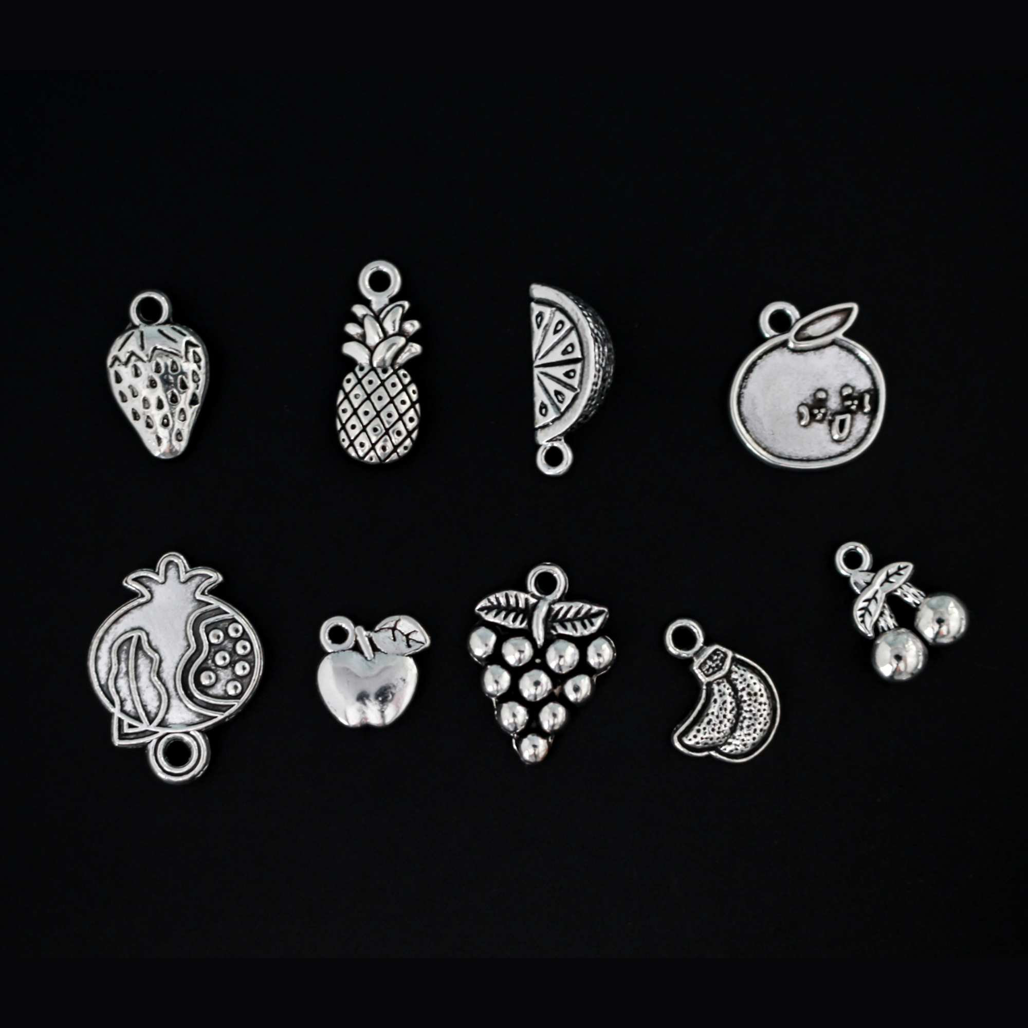 The Fruits of the Holy Spirit charm set. The set consists of 9 fruit charms that are Antiqued silver tone in color