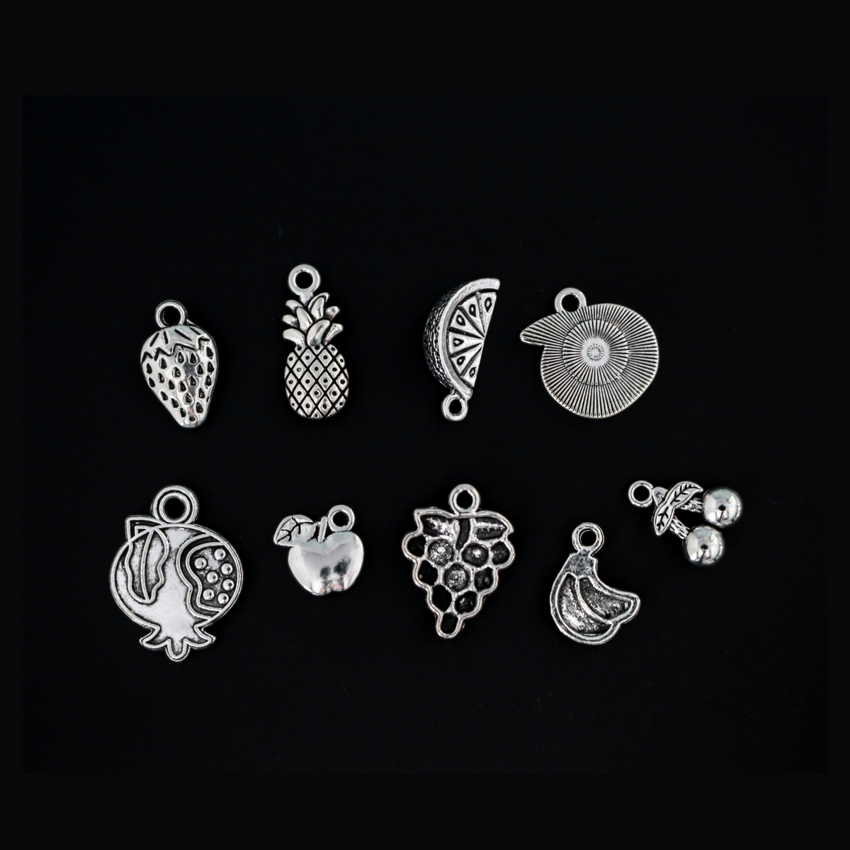 The Fruits of the Holy Spirit charm set. The set consists of 9 fruit charms that are Antiqued silver tone in color