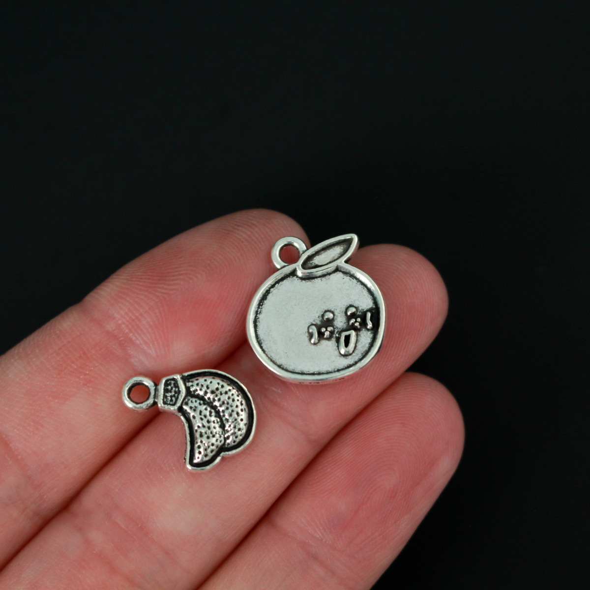 The Fruits of the Holy Spirit charm set. The set consists of 9 fruit charms that are Antiqued silver tone in color