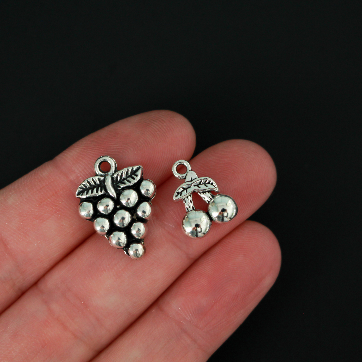 The Fruits of the Holy Spirit charm set. The set consists of 9 fruit charms that are Antiqued silver tone in color