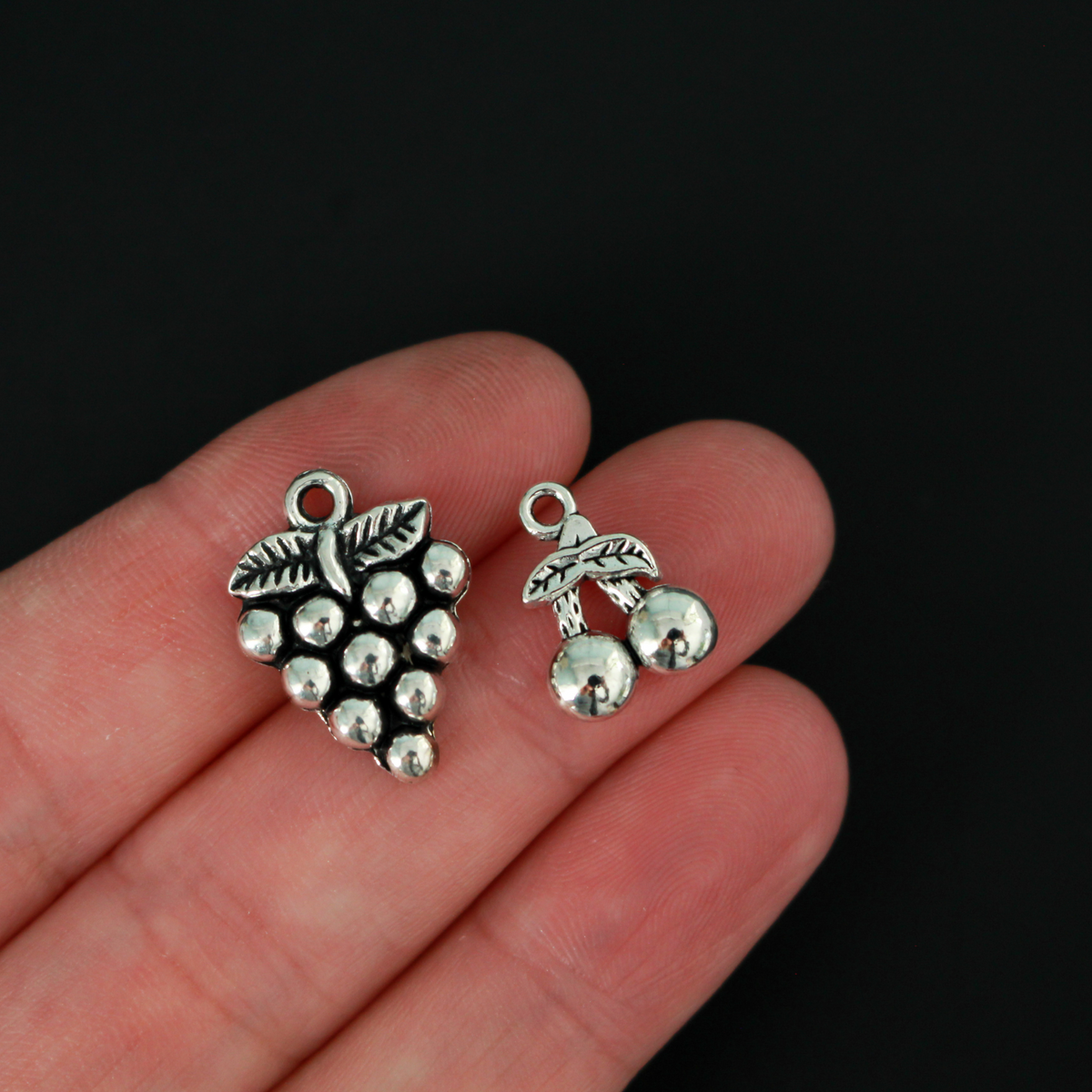 The Fruits of the Holy Spirit charm set. The set consists of 9 fruit charms that are Antiqued silver tone in color