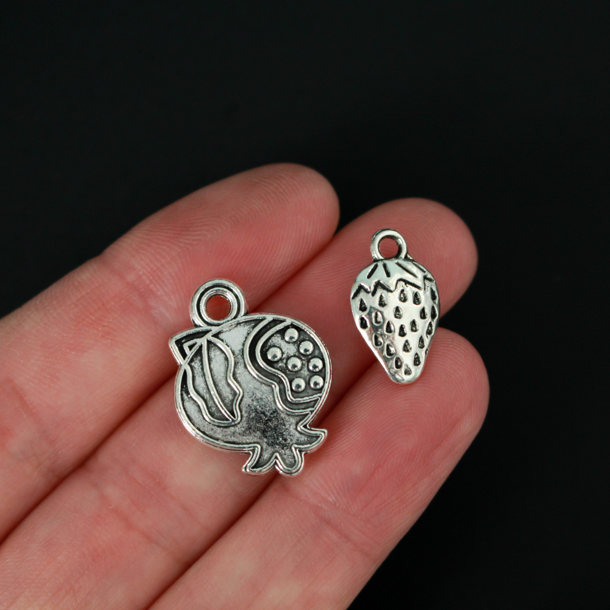 The Fruits of the Holy Spirit charm set. The set consists of 9 fruit charms that are Antiqued silver tone in color