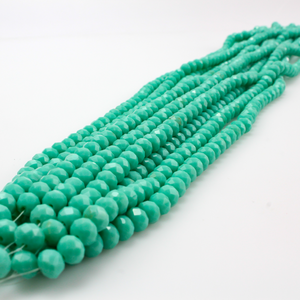 Glass faceted rondelle beads in an opaque aquamarine color 8mmx6mm, one strand is approx. 70 beads