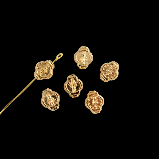 Miraculous Medal oval beads beads that are gold plated with an alloy base metal, made in Italy