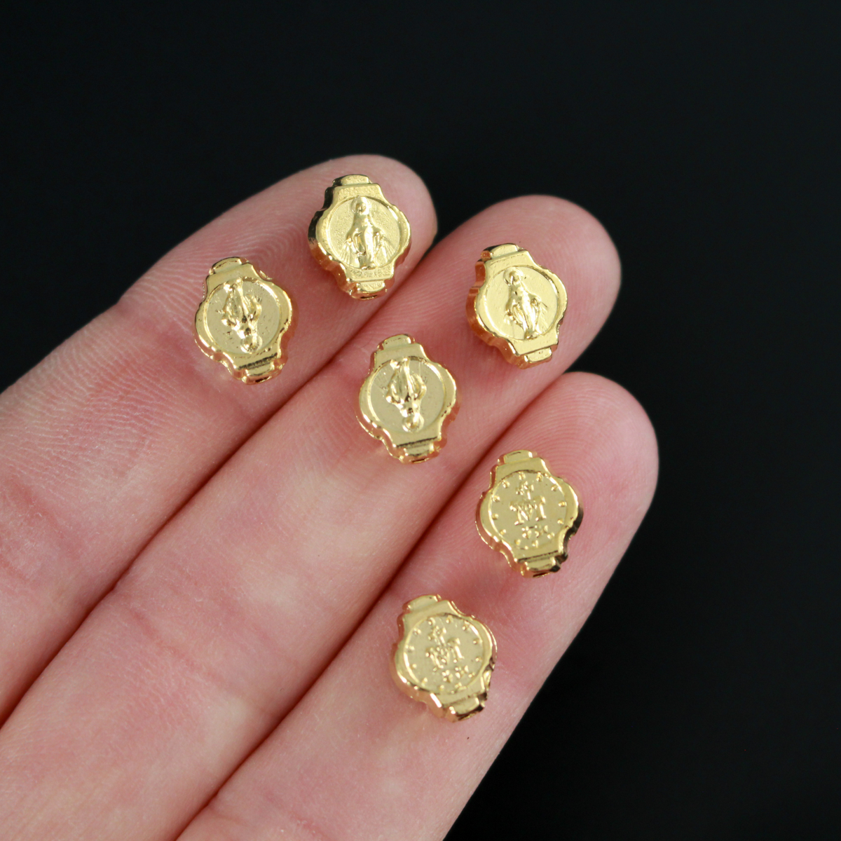Miraculous Medal oval beads beads that are gold plated with an alloy base metal, made in Italy