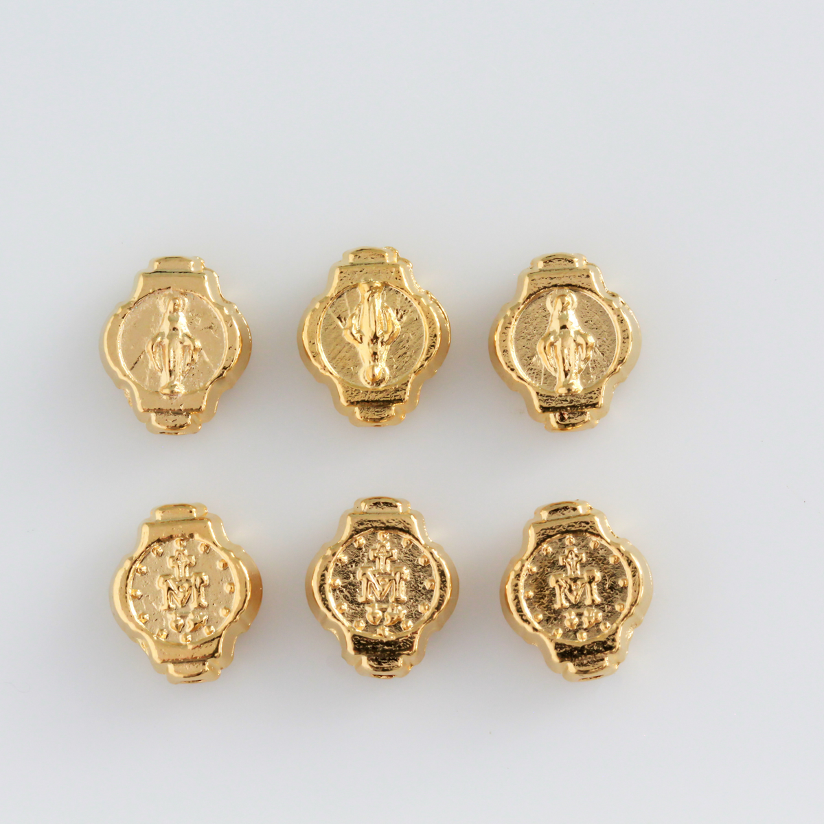 Miraculous Medal oval beads beads that are gold plated with an alloy base metal, made in Italy