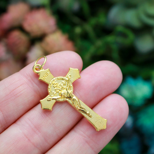 Gold Miraculous Medal crucifix that features flared edges and a detailed Miraculous Medal, front and back