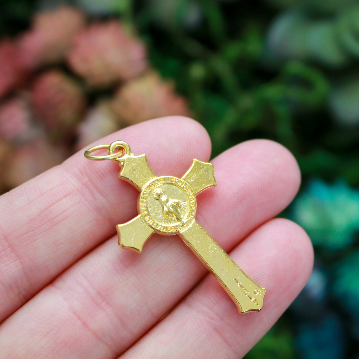 Gold Miraculous Medal crucifix that features flared edges and a detailed Miraculous Medal, front and back