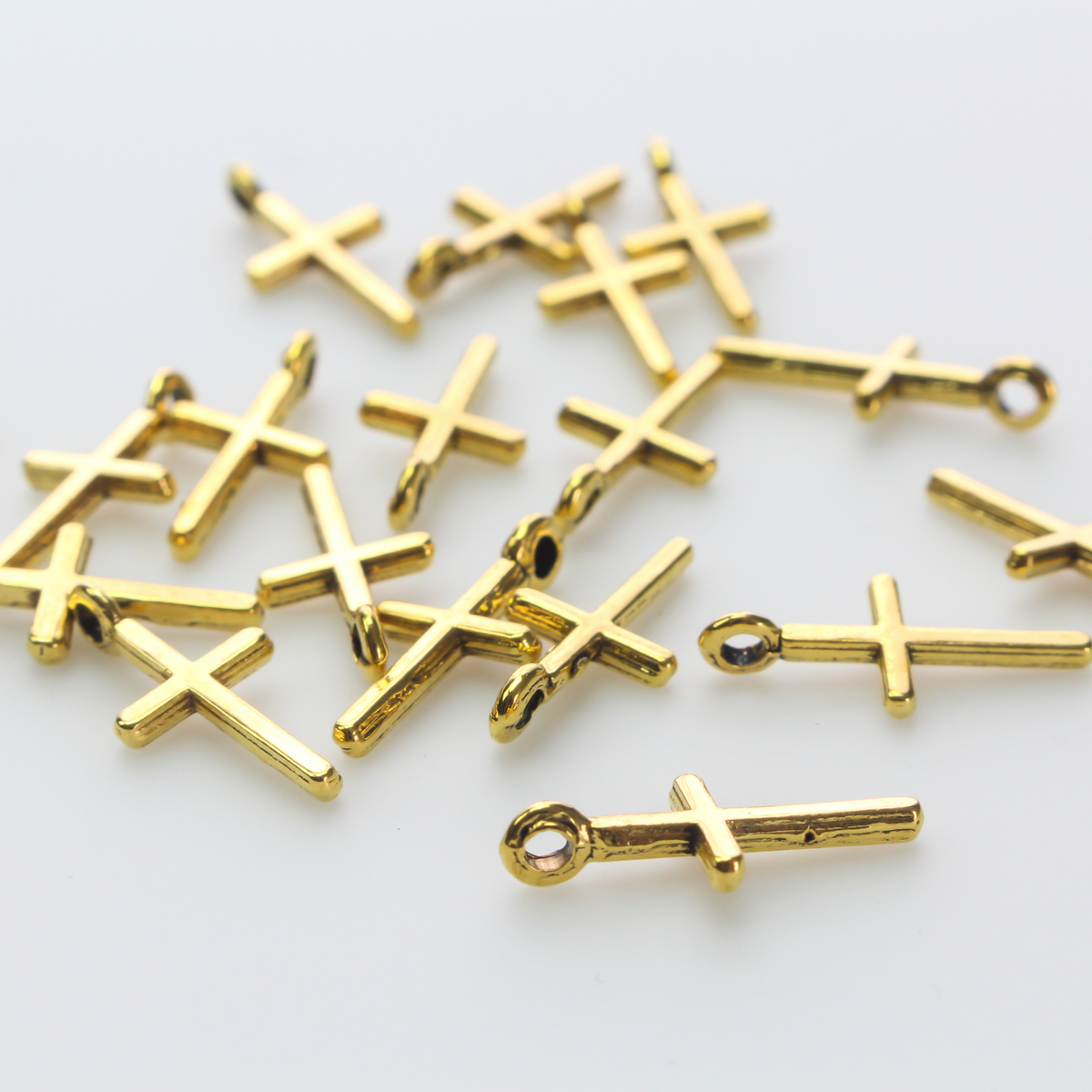 simple gold-tone cross charm 17mm long