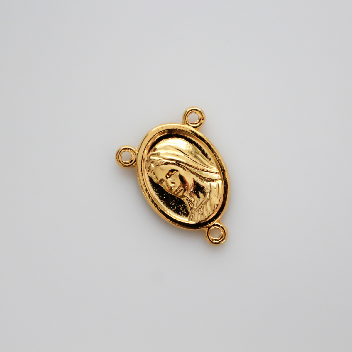 Gold tone rosary centerpiece that features Divine Mercy on the front and Our Lady of Medjugorje on the back