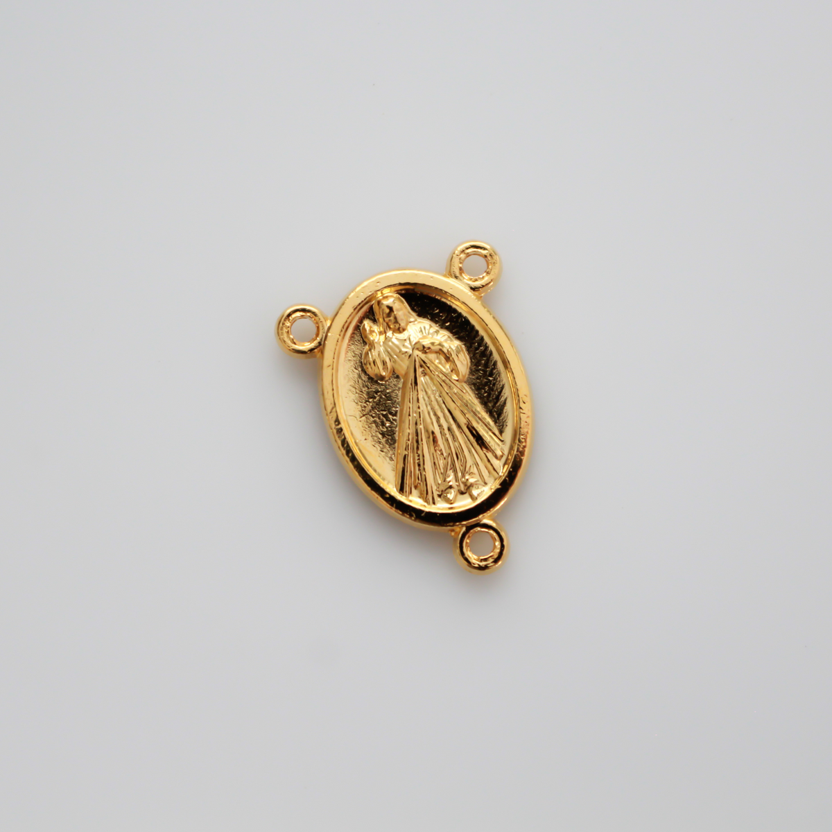 Gold tone rosary centerpiece that features Divine Mercy on the front and Our Lady of Medjugorje on the back