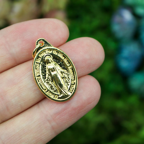 Traditional Miraculous Mary medal in English that is gold plated