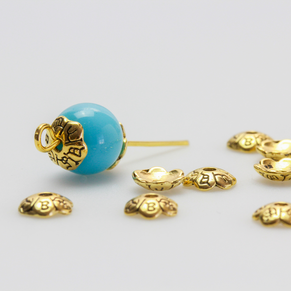 Flower shaped zinc alloy antiqued golden bead caps that are 6mm in diameter. They can fit beads 6mm - 10mm