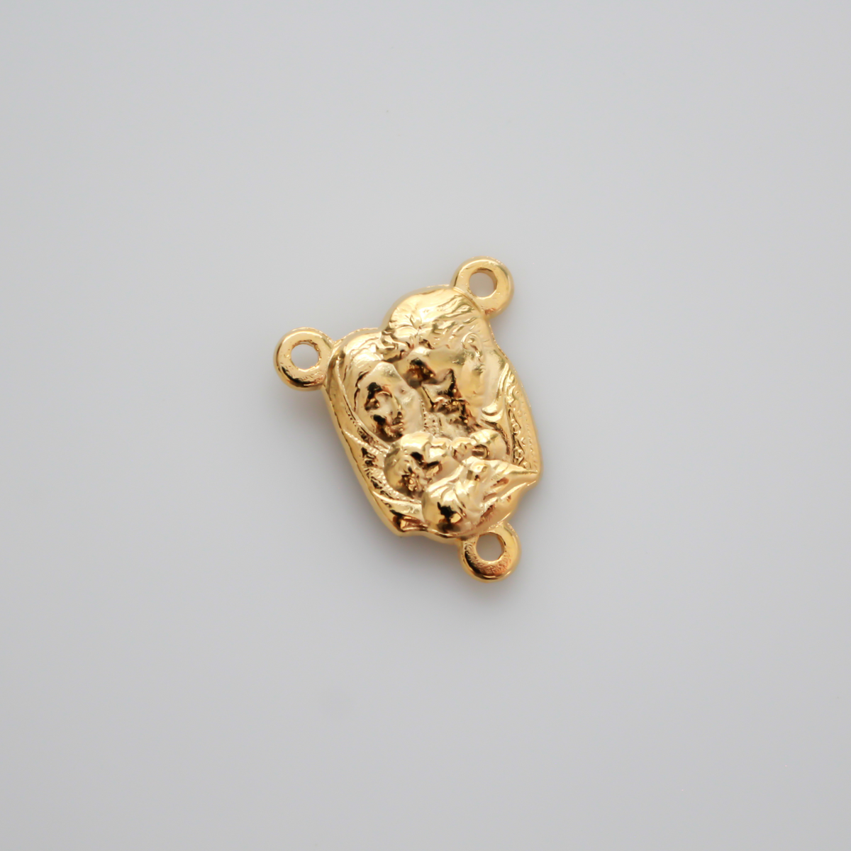 Gold-tone rosary centerpiece features an image of the Holy Family on the front and an image of the Holy Spirit on the back