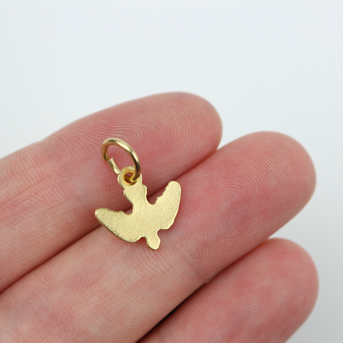 Gold-tone holy spirit dove charm with nice detail. 