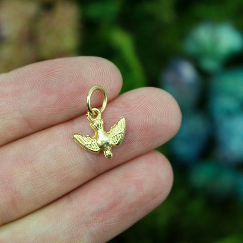 Gold-tone holy spirit dove charm with nice detail. 