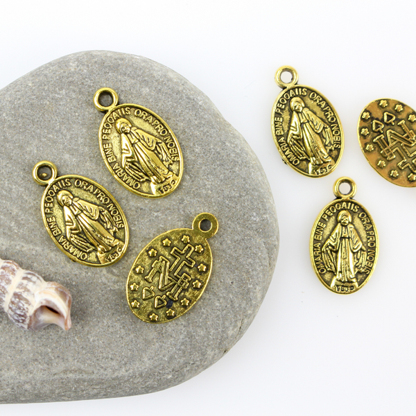 gold tone miraculous mary medal charm
