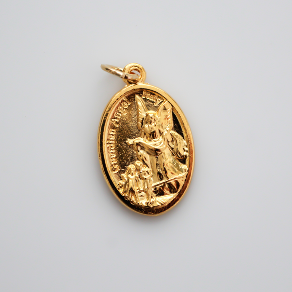 Gold tone Archangel Michael double-sided oval medal. The front depicts St. Michael and the reverse depicts a guardian angel