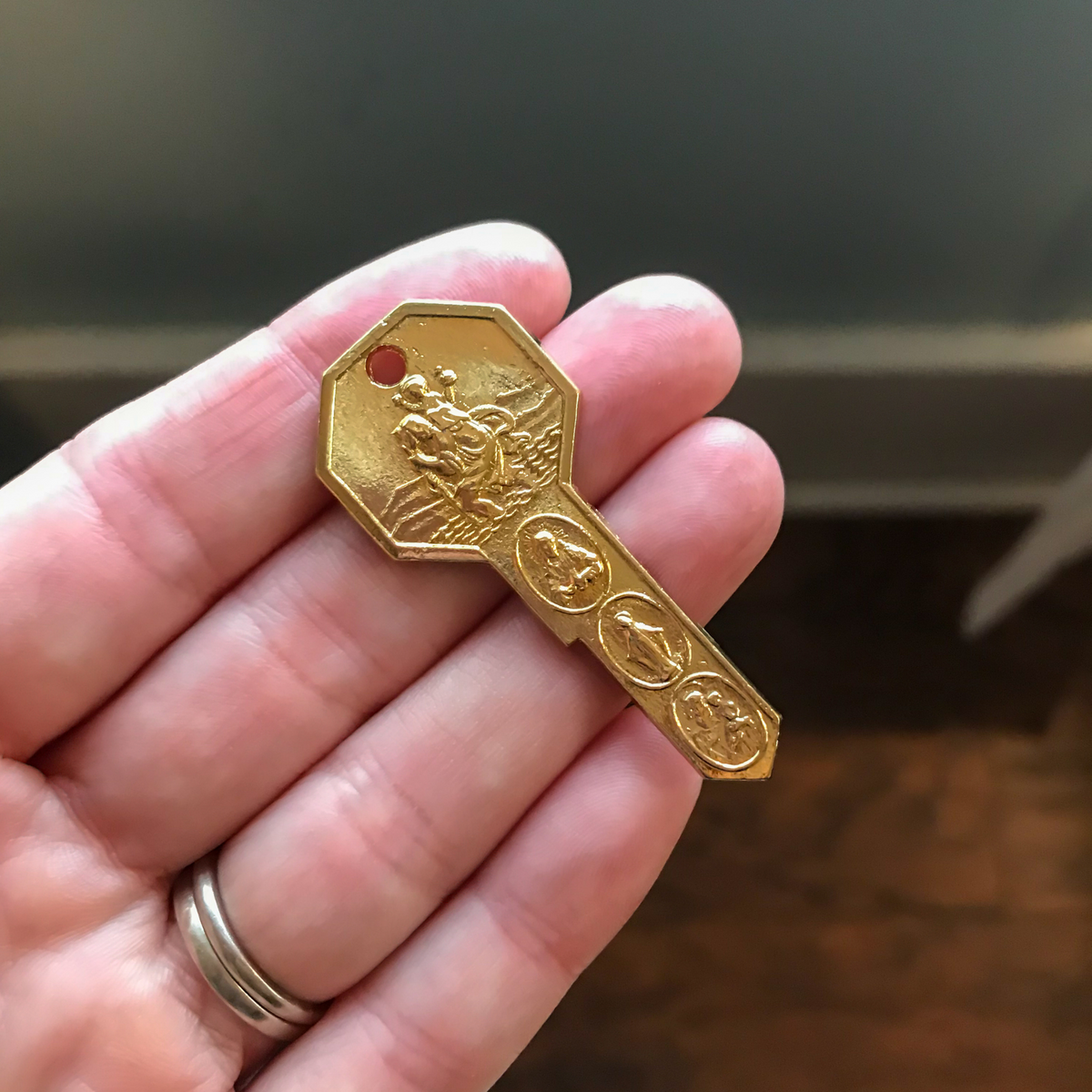 gold plated key shaped seven way patron saint medal made in italy