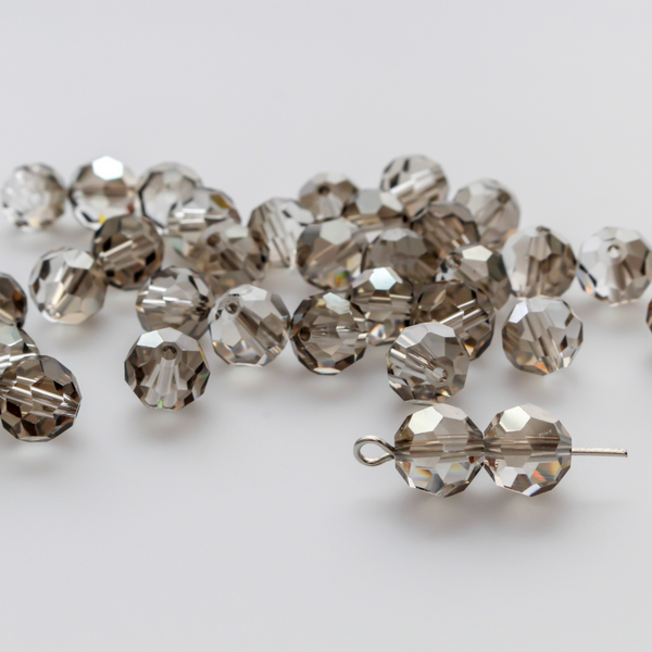 Asian cut crystal glass beads. Smokey gray 8mm round faceted transparent. Sold in packages of 60 beads