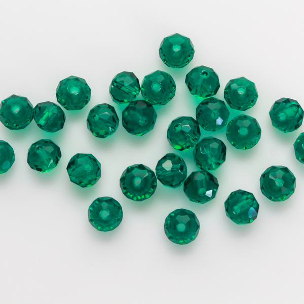 Asian cut crystal glass beads. Peacock Green transparent 8mm x 6.2mm rondelle faceted beads. Sold in packs of 60 beads