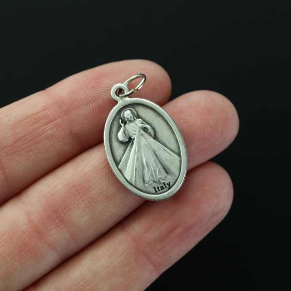 Our Lady of Guadalupe medal with the Divine Mercy of Jesus on the backside.